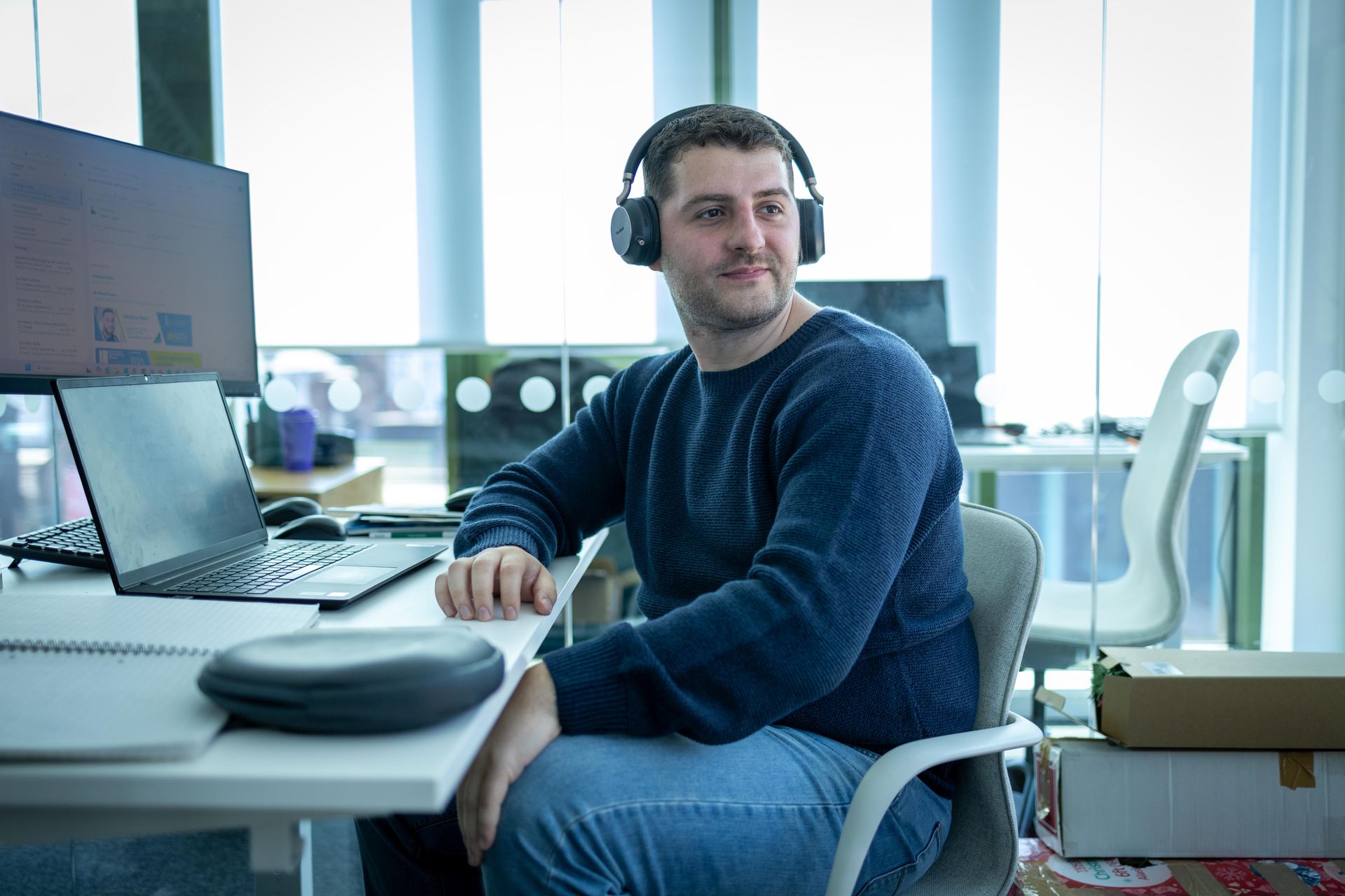 Team member working at his desk in the office